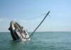 GUYANA-Body of missing fisherman found days after barge reportedly sank. Guyana Police and Coast Guard investigators at Ruimveldt Maritime Police Wharf examine the recovered body of 21-year-old seaman Ravindra Bissoondyal who died after molasses barge TRADER III sank off Buxton East Coast Demerara between March 9 and 11 2026