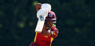 ST. LUCIA-The quiet hunger of Akeem Auguste. Akeem Auguste practicing cricket shot with focused expression on St. Lucia ground
