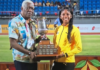 ATHLETICS-Jamaica romps to 40th title; Douglas claims Austin Sealy Award. Jamaican team celebrating with 40th CARIFTA trophy as Douglas holds Austin Sealy Award