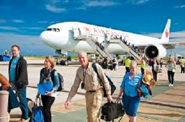 Barbados-arrivals Tourists enjoying safe beach in Barbados Caribbean