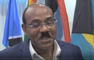 ANTIGUA-PM Browne writes to international groups to observe the general election. PM Browne signing letter to international election observers