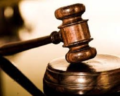 Court SOCU officials filing appeal documents at Guyana court