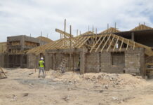 JAMAICA-Jamaicans told to expect higher prices for construction materials. Hardware store shelves with price tags showing increased costs for construction supplies