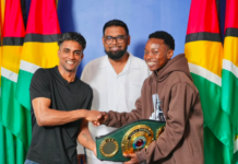 BOXING-Elton Dharry fights for the IBO title on home soil. Elton Dharry in boxing ring with IBO title belt on the line and home crowd cheering