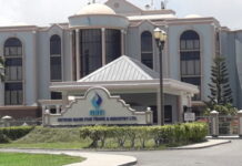 GUYANA-Bank to appeal high court ruling. Guyana high court building with bank appeal documents