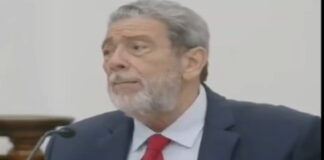 JAMAICA-Former St. Vincent and Grenadines prime minister honored by UWI. Former St. Vincent PM receiving honorary award from UWI officials on stage