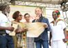 JAMAICA- Government hands over land titles to Rastafarian community in western Jamaica. Jamaican officials handing land titles to Rastafarian community members