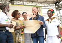 JAMAICA- Government hands over land titles to Rastafarian community in western Jamaica. Jamaican officials handing land titles to Rastafarian community members