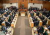 JAMAICA-Government gets green light for NaRRA legislation. Jamaica parliament building with NaRRA legislation approved on screen