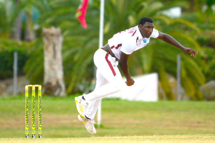 Kelvin Pitman celebrating wicket with teammates on cricket field
