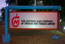 TRINIDAD-NGC records massive after-tax profit. NGC officials reviewing financial charts showing record after-tax profit
