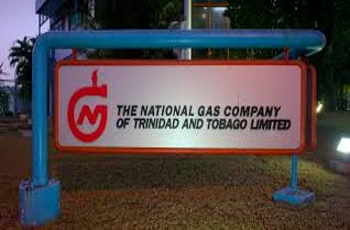 NGC NGC officials reviewing financial charts showing record after-tax profit