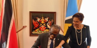 TRINIDAD-ST. Lucia PM pays a courtesy visit and attends the funeral of a ruling party official. St. Lucia Prime Minister offering condolences at funeral of Trinidad ruling party official