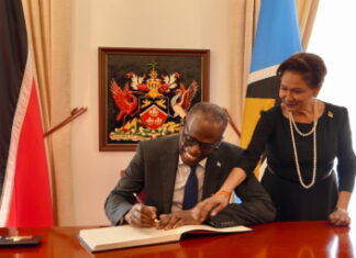 TRINIDAD-ST. Lucia PM pays a courtesy visit and attends the funeral of a ruling party official. St. Lucia Prime Minister offering condolences at funeral of Trinidad ruling party official