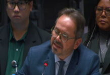 HAITI-UN says Haiti is between political hope and a security emergency UN flag and Haiti flag side by side with divided backdrop representing hope and crisis