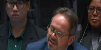 HAITI-UN says Haiti is between political hope and a security emergency UN flag and Haiti flag side by side with divided backdrop representing hope and crisis