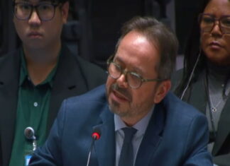 HAITI-UN says Haiti is between political hope and a security emergency UN flag and Haiti flag side by side with divided backdrop representing hope and crisis