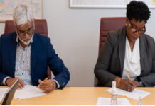 SURINAME-Staatsolie and Tax Department launch new initiative. Staatsolie and Tax Department officials signing agreement at launch event