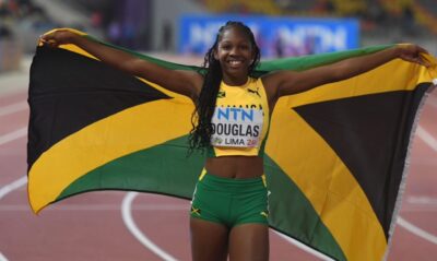 Shanoya-Douglas Douglas and Simmons celebrating final CARIFTA race with medals