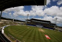 CRICKET-Groundsman takes blame for abandoned match at Sir Viv stadium. Groundsman inspecting wet pitch at Sir Viv Richards Stadium after match abandoned