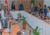 SURINAME-Government and union met on issues affecting air traffic controllers. Government officials and union representatives seated at negotiation table
