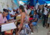 HAITI-Gang violence is affecting the health services for Haitian women and children. Health workers attending to mother and child at clinic amid security concerns in Haiti