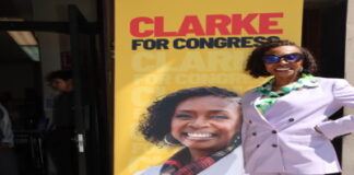UNITED STATES-Caribbean, American Congresswoman launches reelection campaign. Caribbean-American congresswoman waving to crowd at campaign launch event