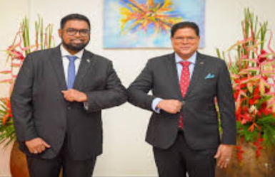 ali-and-santokhi President Ali paying tribute to late Surinamese leader