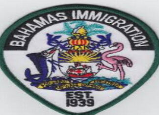 BAHAMAS-Caribbean nationals accused of running afoul of immigration laws. Bahamas immigration officers escorting individuals from detention center