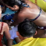 TOBAGO-Police detain one person in fatal jet ski crash. Tobago police officers at beach following fatal jet ski crash