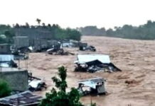 HAITI-Devastating floods leave at least 12 dead in Northwest Haiti. Rescue workers navigating flooded streets in Northwest Haiti after deadly floods