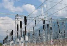 GUYANA-Government invites investors for energy projects. Guyana energy minister speaking at investment forum with renewable energy backdrop