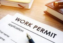 BERMUDA-Government announces updates to proficiency requirement for work permits. Bermuda government official speaking about work permit proficiency updates