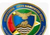 GUYANA-CANU denies allegations of abuse of a suspect in custody. CANU official at podium denying misconduct claims with logo