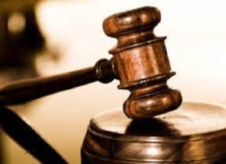 ST. KITTS-Man found guilty of offering cash to a woman who made a rape complaint against another person. Man in court with judge and legal representatives, victim not pictured