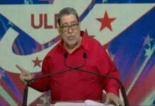 ST. VINCENT-Gonsalves against implementing IMF “austerity” measures. Former Prime Minister Gonsalves speaking at podium rejecting IMF austerity recommendations