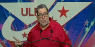 ST. VINCENT-Gonsalves against implementing IMF “austerity” measures. Former Prime Minister Gonsalves speaking at podium rejecting IMF austerity recommendations