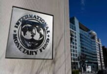 ANTIGUA-IMF welcomes Antigua and Barbuda’s continued economic expansion. IMF representative shaking hands with Antigua finance minister at economic briefing