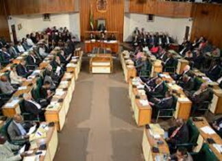 JAMAICA-Government gets green light for NaRRA legislation. Jamaica parliament chamber with NaRRA bill approved on screen