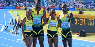 ATHLETICS-Jamaica grabs mixed relay gold in world record time.