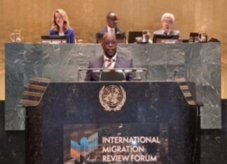 Barbados reiterates its commitment to orderly migration. Barbados foreign minister at UN podium discussing migration policies
