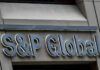 BERMUDA-Government welcomes latest S&P ratings. Bermuda government official holding S&P rating report with positive outlook