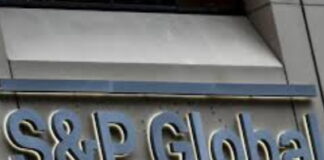 BERMUDA-Government welcomes latest S&P ratings. Bermuda government official holding S&P rating report with positive outlook