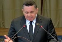 VENEZUELA-Venezuela maintains it does not recognize the ICJ in the order of dispute with Guyana. Venezuelan official at podium with map of disputed region and ICJ logo crossed out