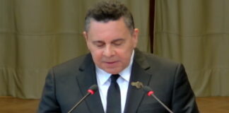 VENEZUELA-Venezuela maintains it does not recognize the ICJ in the order of dispute with Guyana. Venezuelan official at podium with map of disputed region and ICJ logo crossed out