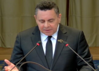 VENEZUELA-Venezuela maintains it does not recognize the ICJ in the order of dispute with Guyana. Venezuelan official at podium with map of disputed region and ICJ logo crossed out