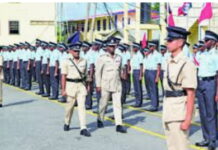 GUYANA-Police officers under probe. Guyana Police Force emblem with magnifying glass and question mark