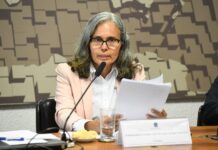 GUYANA–Guyana Brazil trade surges to US$1 billion as ties deepen Guyana and Brazil trade officials shaking hands with billion-dollar contract graphic