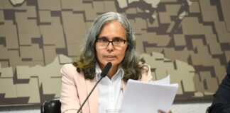 GUYANA–Guyana Brazil trade surges to US$1 billion as ties deepen Guyana and Brazil trade officials shaking hands with billion-dollar contract graphic