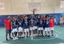 BASKETBALL-Cayman U-17 boys claim bronze in gritty International debut. Young Cayman players celebrating with bronze medals after final buzzer